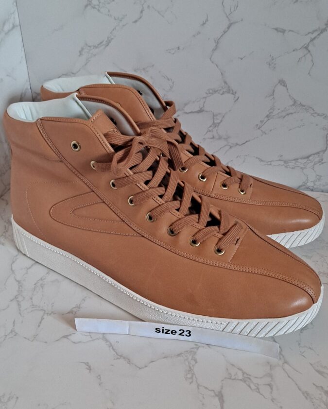 Tan high-top leather sneakers with white soles