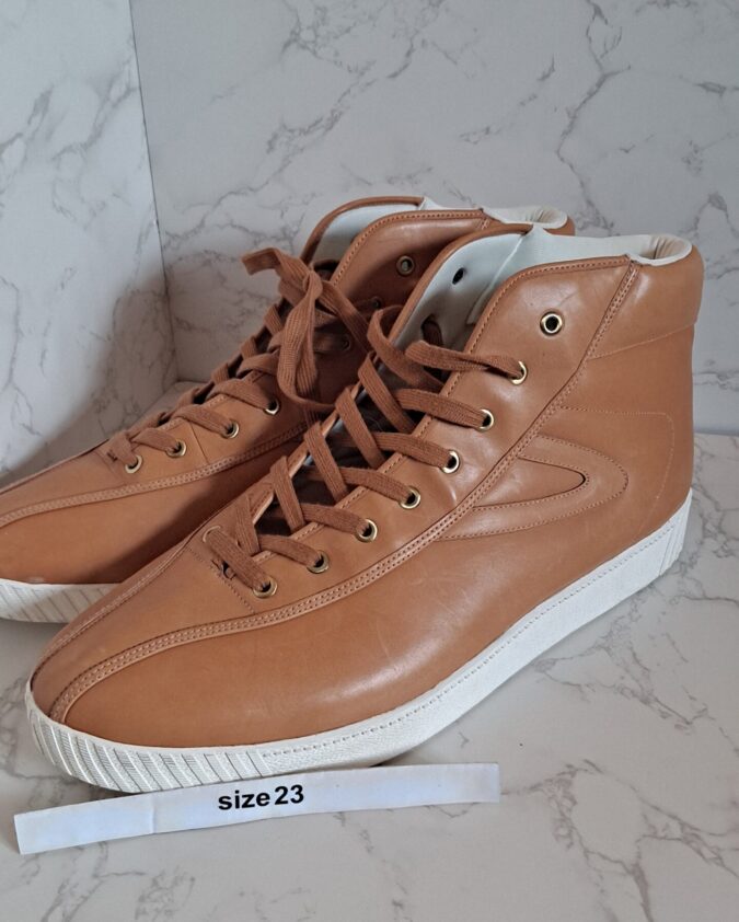 Pair of tan high-top sneakers size 23