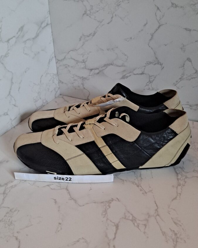 Pair of beige and black retro sneakers